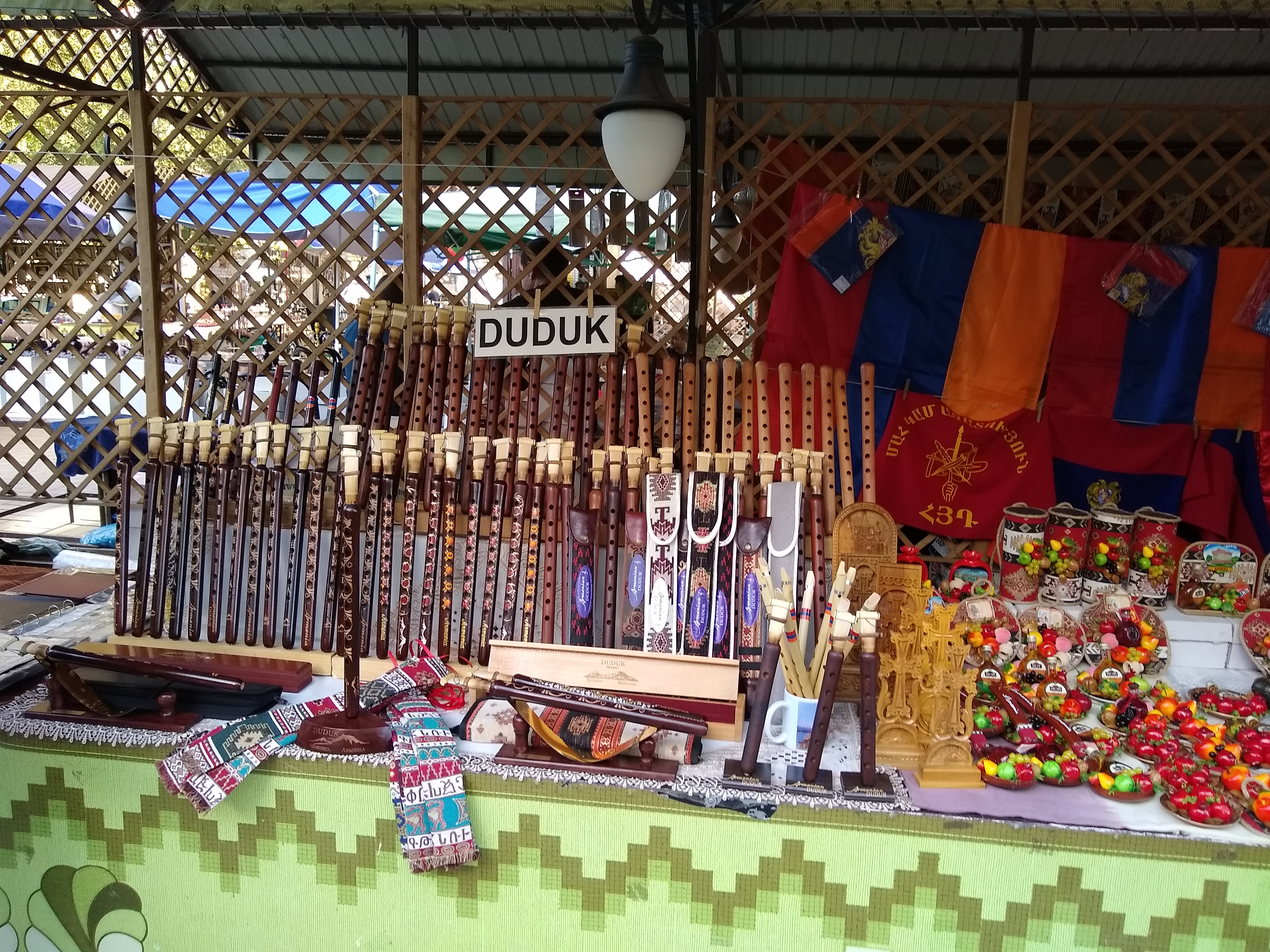 Photo of a market stall selling Armenian flutes, known as duduks