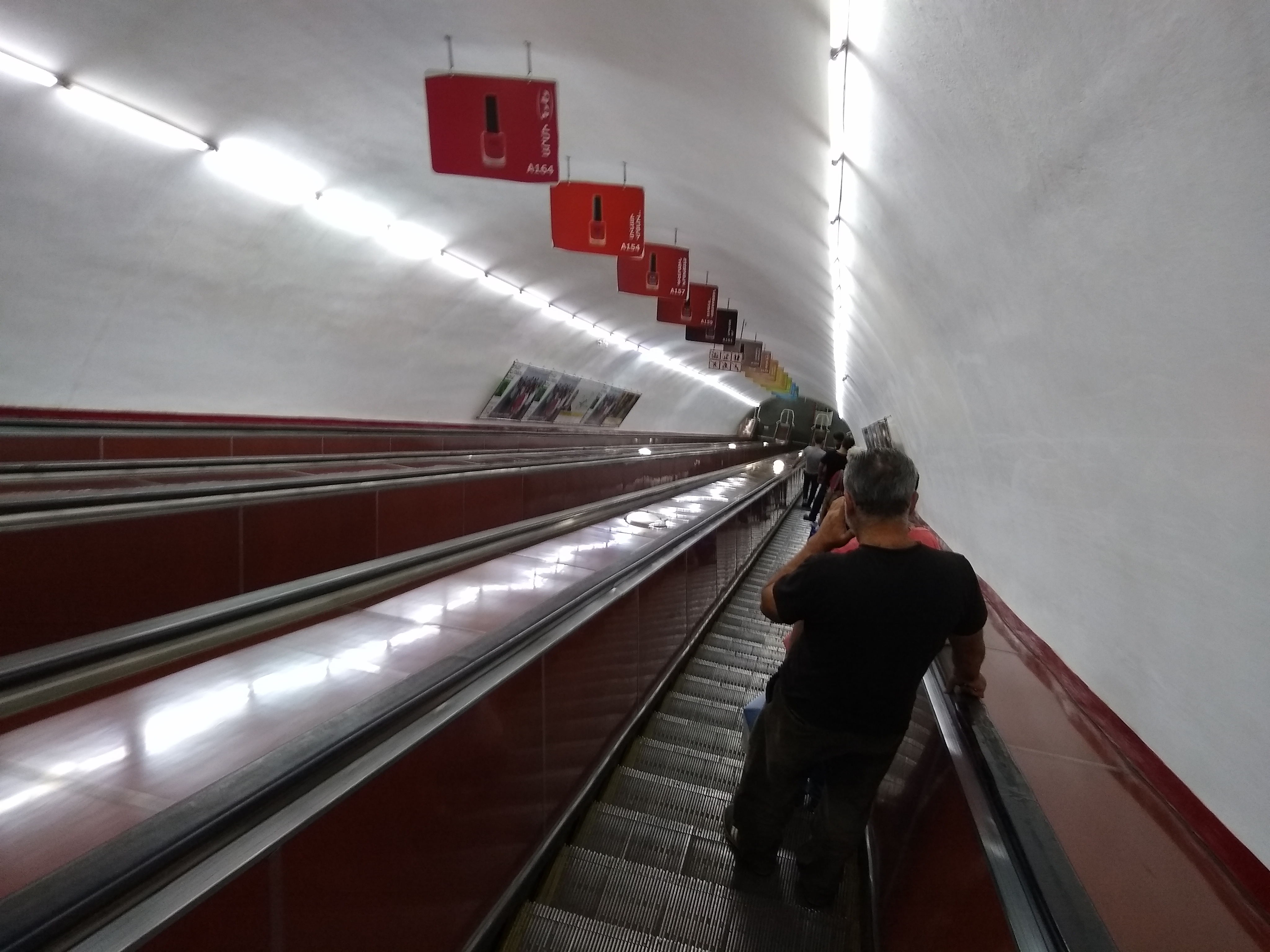 A photo of going down a steep escalator