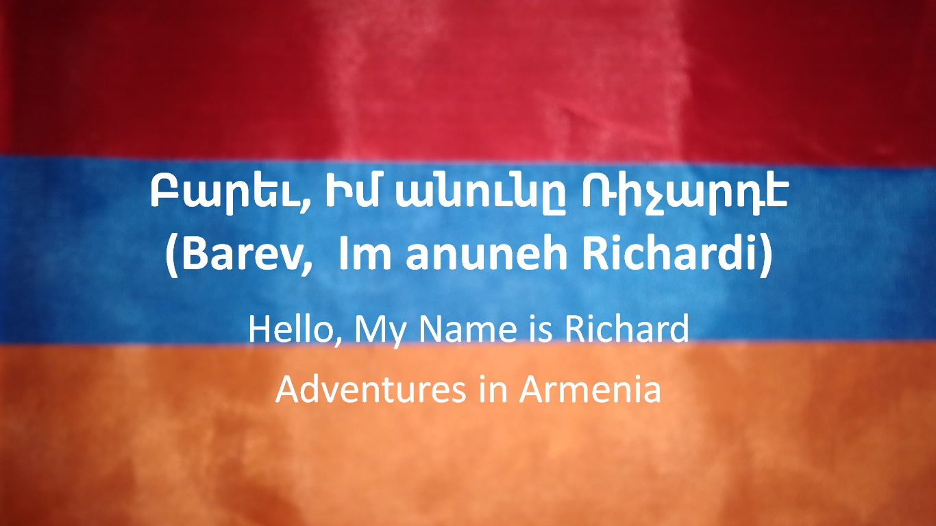 Photo of an Armenian flag with Armenian text, the Latinized barev dzez, in anuni Richardi, with the translation hello, my name is Richard. Followed by the text adventures in Armenia