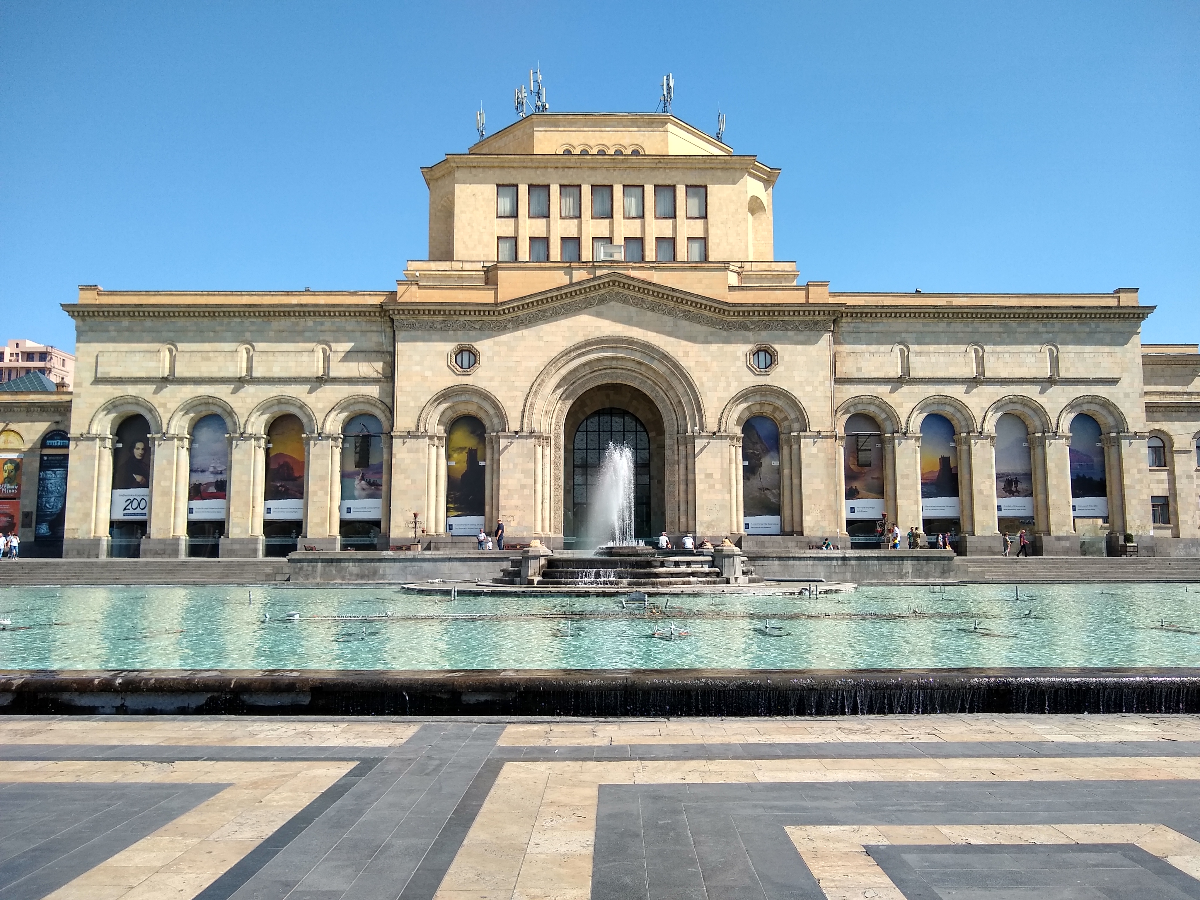 A photo of the History Museum of Armenia, with the Singing Fountain and its large pool in front of it